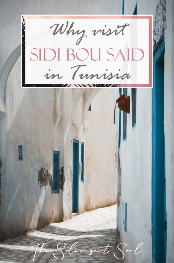 Why visit Sidi Bou Said in Tunisia. A beautiful town of blue gates and white buildings. With pink flowers and overseeing the Mediterranean, this is a beautiful small town with fantastic beaches and next to Cartague and Tunis | The Solivagant Soul Travel Blog