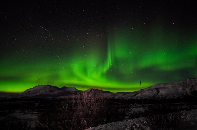 A detailed guide on how to see the Northern lights and find the most outstanding Aurora Borealis in Iceland, Norway, Canada or Greenland. From tips on how to know the intensity of the Northern Lights as well as the best places to see them. #Northernlights #auroraborealis #sunstorm #wintertravel #naturalwonders | The Solivagant Soul Travel Blog